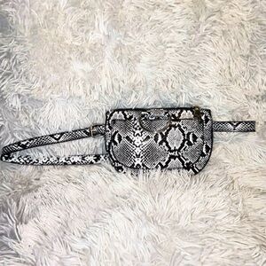 Black & white faux leather adjustable fanny pack. NEVER WORN